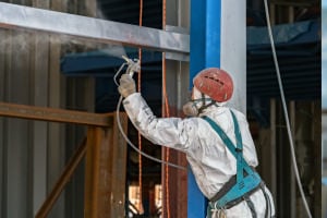 Applying-an-aerosol-coating-to-metal.