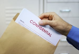 confidential-information-letter-hand.jpg