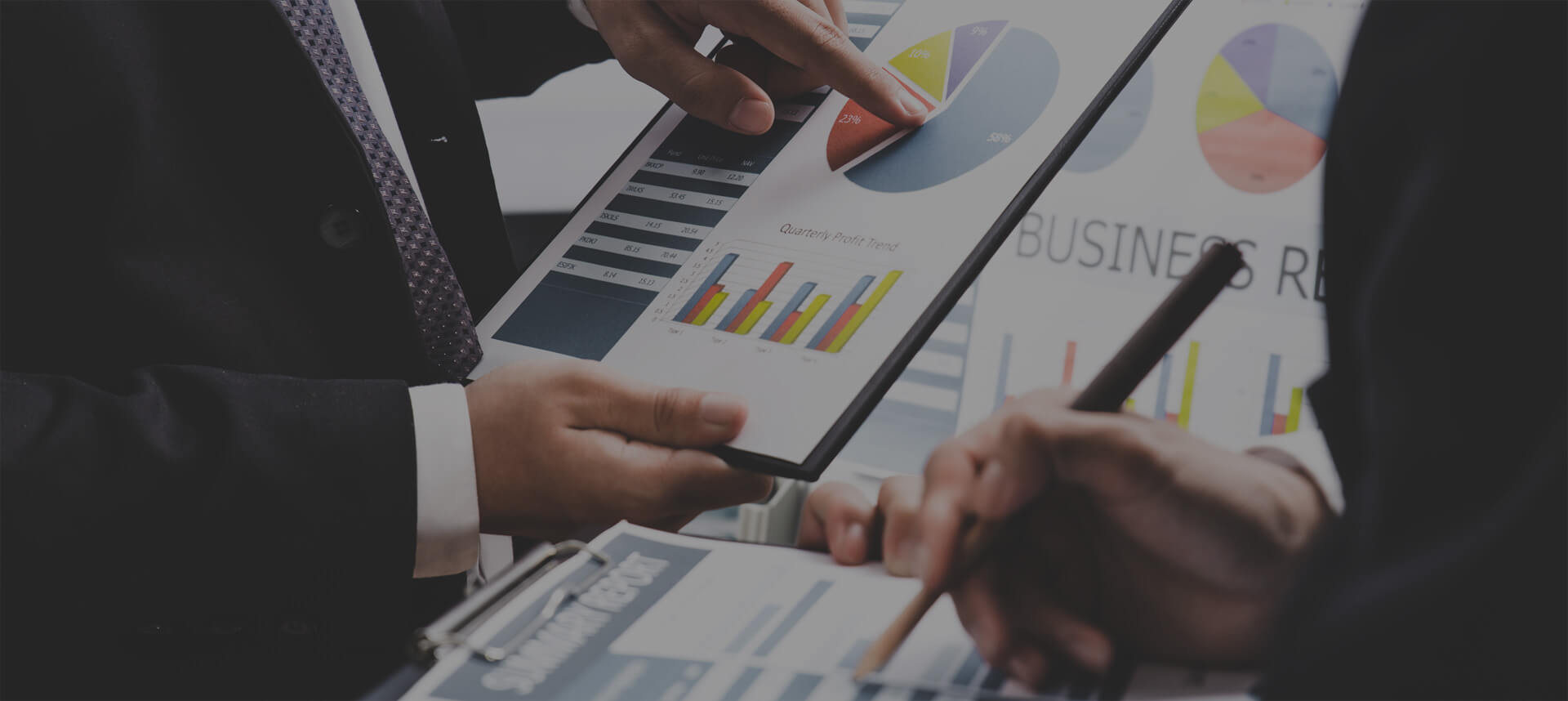 Executives looking at corporate sustainability and carbon footprint reports.