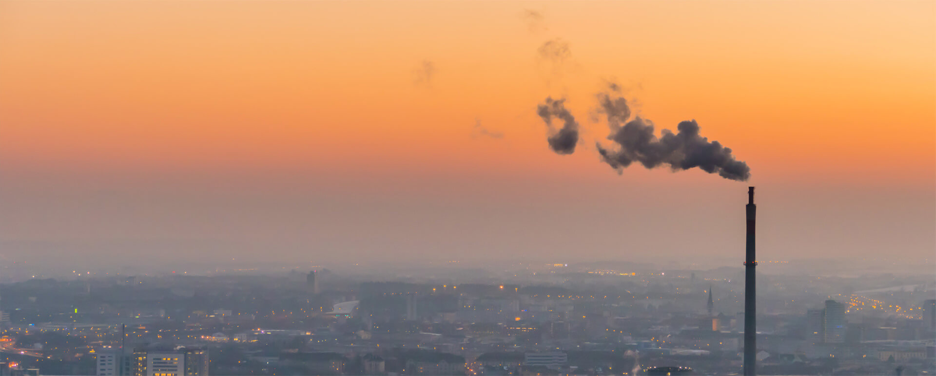 An emissions stack polluting hazardous chemicals and greenhouse gasses into the environment.